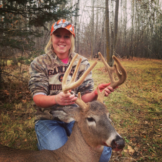 Ashley Huntley with a Minnesota 9-point velvet buck she killed in early November. Cool!