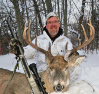 The author with a gorgeous buck dropped with his Traditions muzzleloader, which he treats carefully during and after the season to achieve optimal performance.