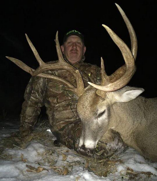 Tim Young of Iowa and a cool buck with a wild drop tine!