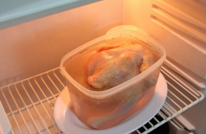 Brining is a centuries-old method of using salt, water and possibly other spices to infuse flavor in wild and domestic meats. This chicken is soaking in a brine mixture for a few hours before being removed and cooked. (PHOTO: WikiCommons)